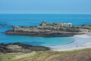 View over Chateau A L'Etoc (Chateau Le Toc) and Saye Beach, Alderney, Channel Islands