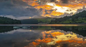 View of dramatic clouds reflecting in Ladybower Reservoir at sunset View of dramatic clouds reflecting in Ladybower Reservoir at sunset