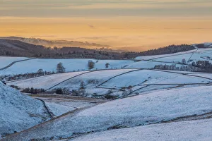 View of frozen landscape near Macclesfield at sunset, High Peak, Cheshire, England View of frozen landscape near Macclesfield at sunset, High Peak, Cheshire, England