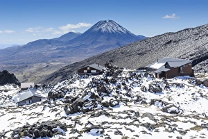 View from Mount Ruapehu of Mount Ngauruhoe with a ski cottage in the foreground View from Mount Ruapehu of Mount Ngauruhoe with a ski cottage in the foreground