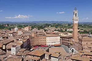 Rooftops Gallery: View over the old town including Piazza del Campo with Palazzo Pubblico town hall