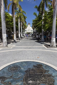 View along palm lined avenue to courthouse with pavement map of the island, Philipsburg View along palm lined avenue to courthouse with pavement map of the island, Philipsburg