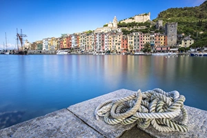 View from the pier of blue sea which frames the typical colored houses of Portovenere View from the pier of blue sea which frames the typical colored houses of Portovenere