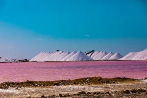 View of the pink colored ocean overlooking the Salt Pyramids of Bonaire from afar View of the pink colored ocean overlooking the Salt Pyramids of Bonaire from afar