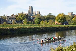 View across the River Wear to Durham Cathedral, female college rowers in training, Durham, County Durham, England