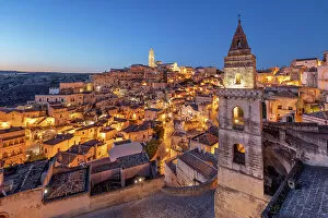 Places Of Worship Gallery: View over the Sassi di Matera old town with the campanile of the church of Saint Peter Barisano floodlit at dawn