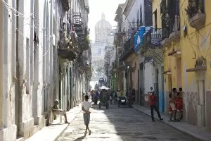 Images Dated 15th March 2010: View along a typical residential street in Havana Vieja showing children playing