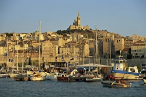 View across the Vieux Port to the basilica of Notre Dame de la Garde, Marseille View across the Vieux Port to the basilica of Notre Dame de la Garde, Marseille