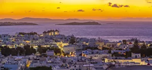 View of windmills and Aegean Sea from elevated position at sunset, Mykonos Town, Mykonos View of windmills and Aegean Sea from elevated position at sunset, Mykonos Town, Mykonos