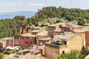 Village houses and the entrance of the Ochre trail in the background, Roussillon Village houses and the entrance of the Ochre trail in the background, Roussillon