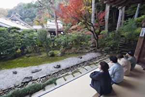 Visitors contemplating the garden at Nison in (Nisonin) Temple dating from 834 Visitors contemplating the garden at Nison in (Nisonin) Temple dating from 834