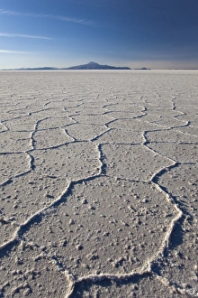 Volcano Tunupa on the horizon of the Salar de Uyuni, the biggest salt desert in the world Volcano Tunupa on the horizon of the Salar de Uyuni, the biggest salt desert in the world
