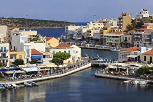 Voulismeni Lake, lined with cafes and restaurants, bridge crosses a narrow channel Voulismeni Lake, lined with cafes and restaurants, bridge crosses a narrow channel