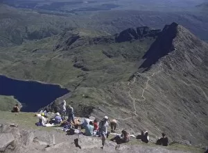Images Dated 12th February 2008: Walkers relaxing at the summit of Mount Snowdon, with Llyn Llydaw reservoir