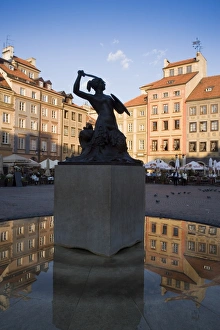 Warsaw Mermaid Fountain and reflections of the Old Town houses Warsaw Mermaid Fountain and reflections of the Old Town houses