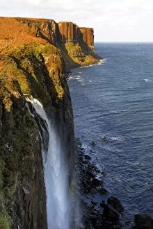 Sun Lit Gallery: Waterfall at Kilt Rock, famous basaltic cliff near Staffin, Isle of Skye