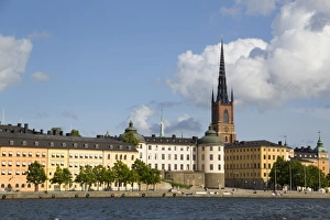 Waterfront with Riddarholmen Church in background, Gamla Stan, Stockholm, Sweden Waterfront with Riddarholmen Church in background, Gamla Stan, Stockholm, Sweden