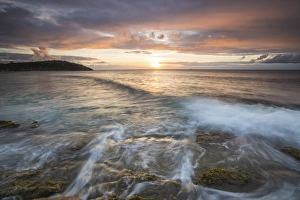 Waves crash on cliffs under a colorful Caribbean sunset, Galley Bay, St. Johns, Antigua Waves crash on cliffs under a colorful Caribbean sunset, Galley Bay, St. Johns, Antigua