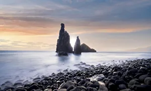 Waves crashing on volcanic stone beach and sea stacks of Ilheus da Rib Waves crashing on volcanic stone beach and sea stacks of Ilheus da Rib