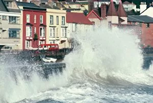 Natural Phenomena Gallery: Waves pounding sea wall and rail track in storm, Dawlish, Devon, England