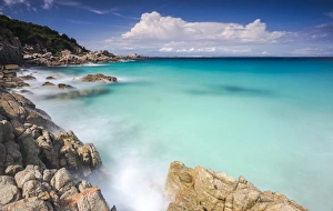 White rocks and cliffs frame the waves of turquoise sea, Santa Teresa di Gallura White rocks and cliffs frame the waves of turquoise sea, Santa Teresa di Gallura