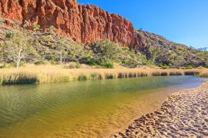 White sand at shoreline of waterhole at Glen Helen Gorge on Finke River in the dry season White sand at shoreline of waterhole at Glen Helen Gorge on Finke River in the dry season