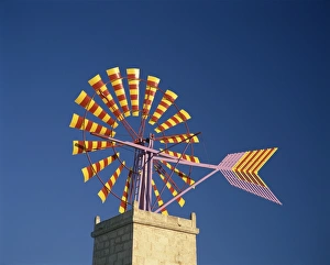 Windmill with sails in the colours of the Mallorcan flag Windmill with sails in the colours of the Mallorcan flag