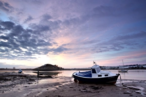 Winter sunrise on the Aln Estuary looking towards Church Hill with boats moored Winter sunrise on the Aln Estuary looking towards Church Hill with boats moored