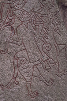 Carvings Gallery: Witch from Icelandic Edda riding a wolf, detail of standing stone circa 1000AD