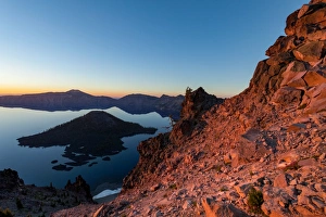 Wizard Island and the still waters of Crater Lake at dawn, the deepest lake in the U Wizard Island and the still waters of Crater Lake at dawn, the deepest lake in the U