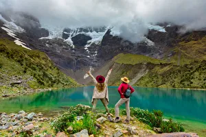Two woman enjoying the view of crystal clear Humantay Lake, Cusco, Peru, South America Two woman enjoying the view of crystal clear Humantay Lake, Cusco, Peru, South America