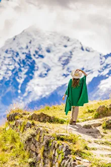 Woman enjoying the view high in the Andes Mountains while exploring Inti Punku (Sun Gate) Woman enjoying the view high in the Andes Mountains while exploring Inti Punku (Sun Gate)