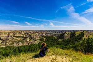 Woman enjoying the view along the Theodore Roosevelt National Park North Unit Woman enjoying the view along the Theodore Roosevelt National Park North Unit