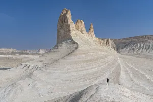 Woman photographing Bozzhira Canyon, Ustyurt plateau, Mangystau, Kazakhstan, Central Asia, Asia Woman photographing Bozzhira Canyon, Ustyurt plateau, Mangystau, Kazakhstan, Central Asia, Asia