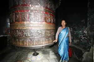 Woman and prayer wheel, Swayambhunath Temple, Kathmandu, Nepal, Asia Woman and prayer wheel, Swayambhunath Temple, Kathmandu, Nepal, Asia