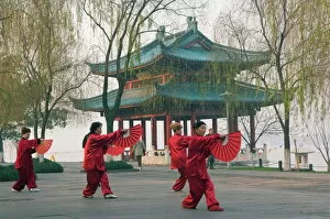 Far East Collection: Women practising tai chi in front of a pavilion on West Lake, Hangzhou