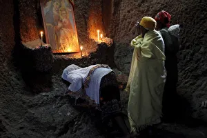 Women praying in Bet Medhane Alem church in Lalibela, Wollo, Ethiopia, Africa Women praying in Bet Medhane Alem church in Lalibela, Wollo, Ethiopia, Africa