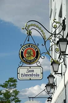 Munich (Munchen) Gallery: Wrought iron sign advertising Paulaner and Lowenbrau beer, Wolfrathausen