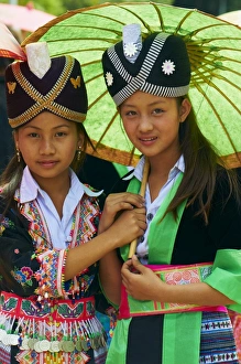 Young Hmong women in traditional dress, Lao New Year festival, Luang Prabang Young Hmong women in traditional dress, Lao New Year festival, Luang Prabang