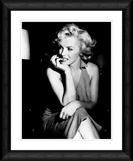 Images Dated 9th April 2008: Marilyn Monroe Candid Pose Holding a Cigarette Framed Print