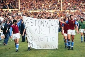 Aston Villa Collection: Aston Villa players parade a banner at Wembley after the 1977 League Cup Final