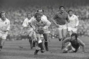 Englands Peter Wheeler makes a break against France - 1975 Five Nations Englands Peter Wheeler makes a break against France - 1975 Five Nations