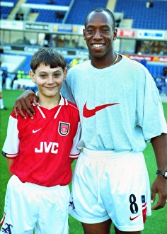 Football Leicester City v Arsenal. Ian Wright with Arsenal Mascot Steve Rose Football Leicester City v Arsenal. Ian Wright with Arsenal Mascot Steve Rose