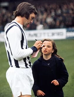 Jeff Astle signs an autograph for a young West Bromwich Albion fan