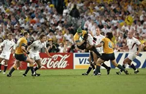 Images Dated 19th April 2001: Jonny Wilkinson puts in a huge tackle during the 2003 World Cup Final