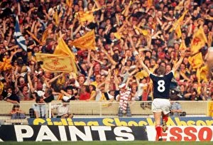 Related Images Collection: Kenny Dalglish celebrates his goal in front of the Scotland fans at Wembley - 1977 British Home