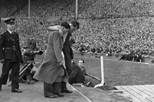 Images Dated 14th February 2008: Manchester Citys Jimmy Meadows leaves the field with a knee injury in the 1955 FA Cup Final