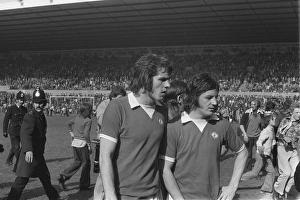Manchester Uniteds Jim Holton and Alex Forsyth leave the field after United fans invade Manchester Uniteds Jim Holton and Alex Forsyth leave the field after United fans invade