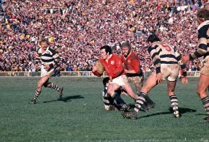 Images Dated 27th July 2012: Phil Bennett makes a break for the Lions on the way to scoring a try against Auckland in 1977