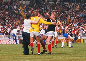 Images Dated 4th June 1977: Scotland goalkeeper Alan Rough celebrates with teammate Gordon McQueen after victory at Wembley - 1977 British Home Championship